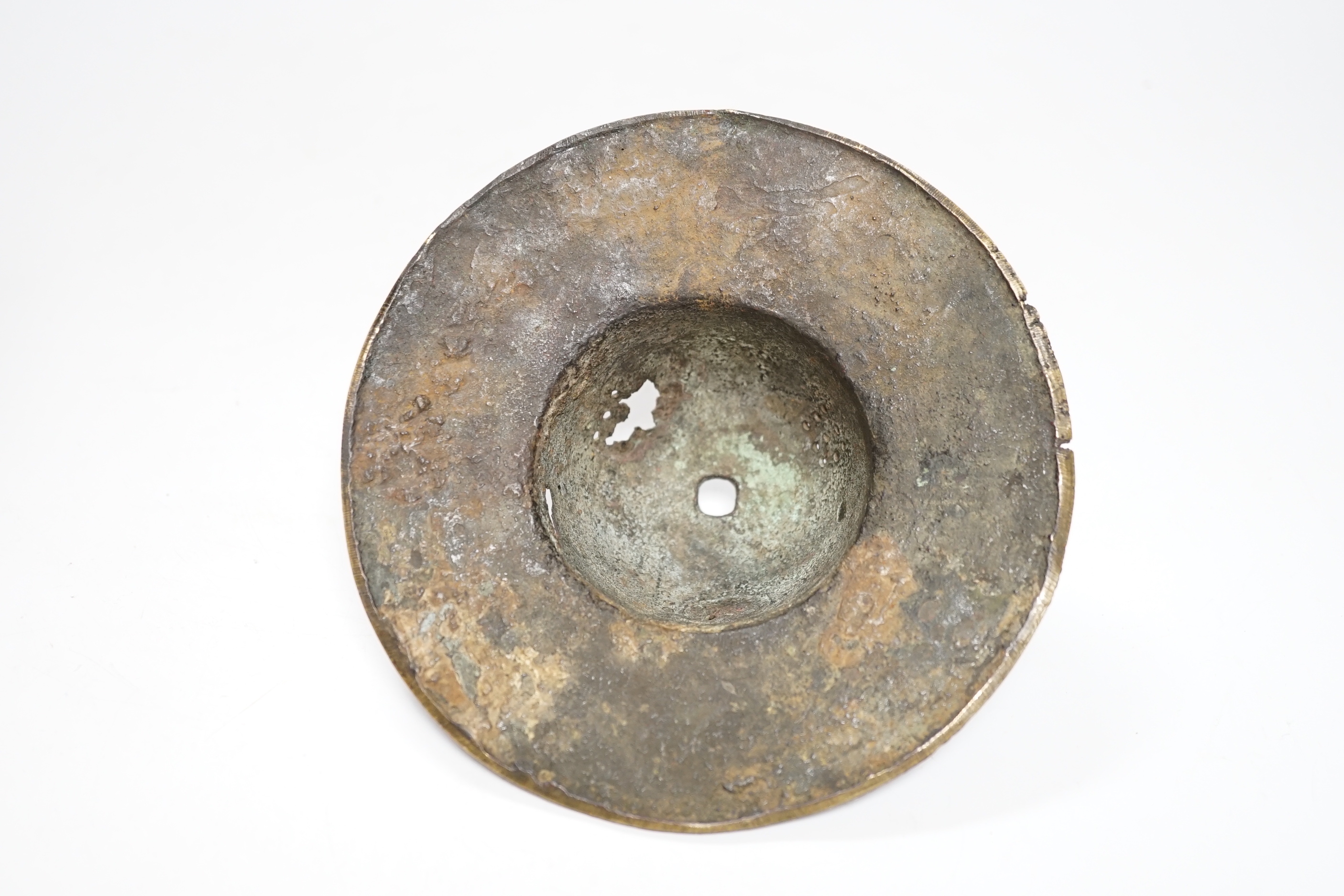 An early Islamic bronze and copper inlaid shield or door boss, probably 12th/13th century, 14.5cm